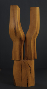wood abstract sculpture with a thick brown base and two brown sections attached above it